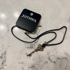 Disturbia Black and Gold Skull Key Pendant Necklace
